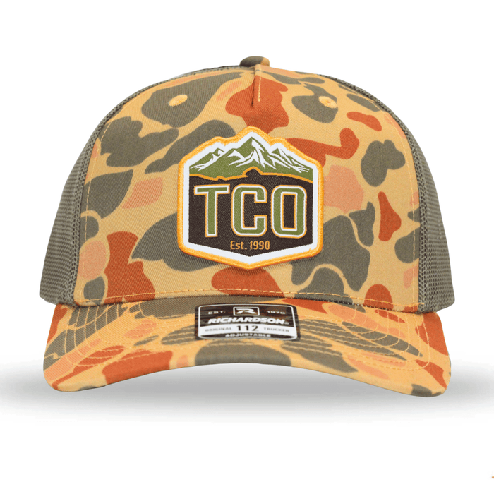TCO Fly Shop Trucker Hat - OG Crest Logo - Sienna Duck Camo Loden